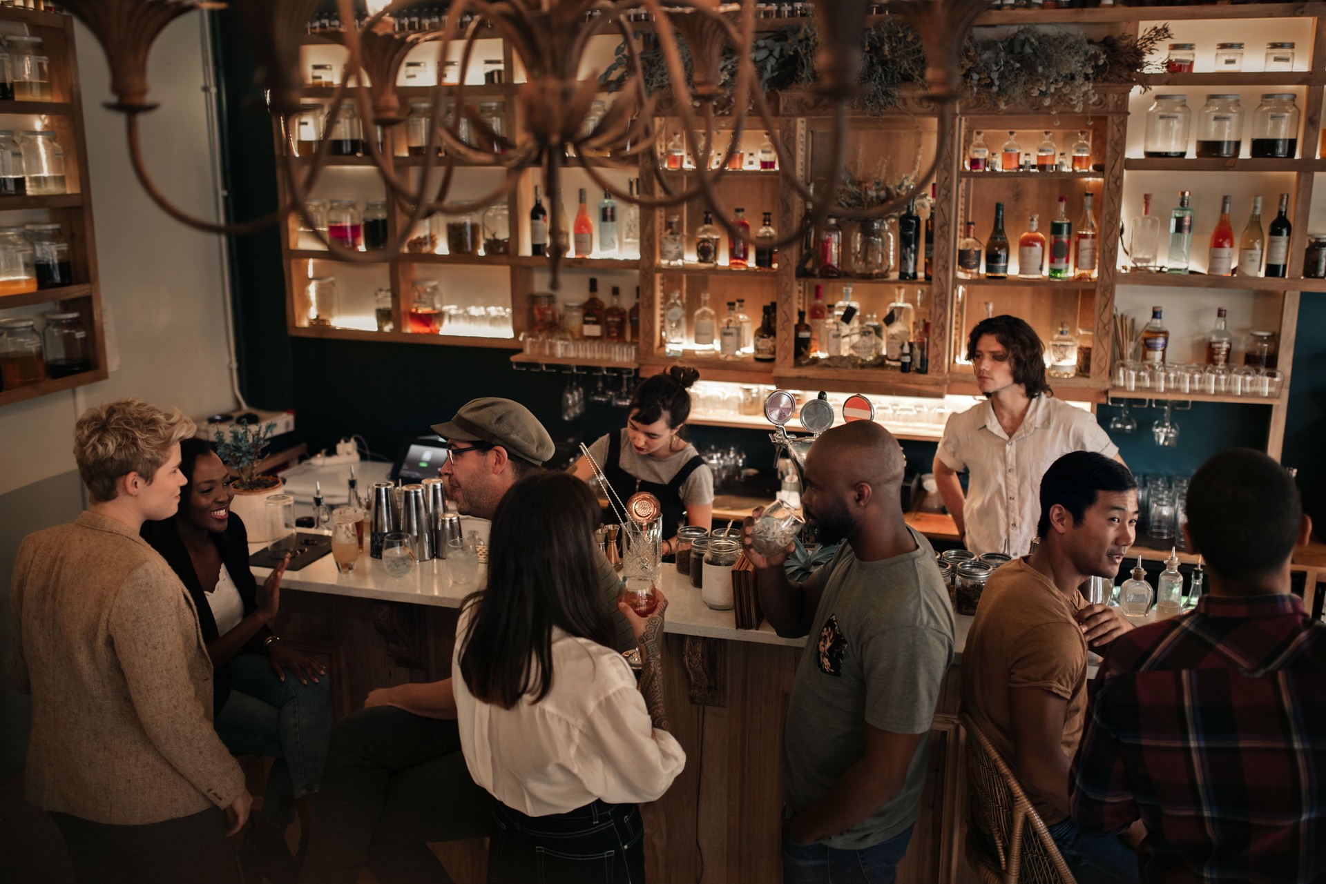 Diverse young people enjoying a night out at the pub