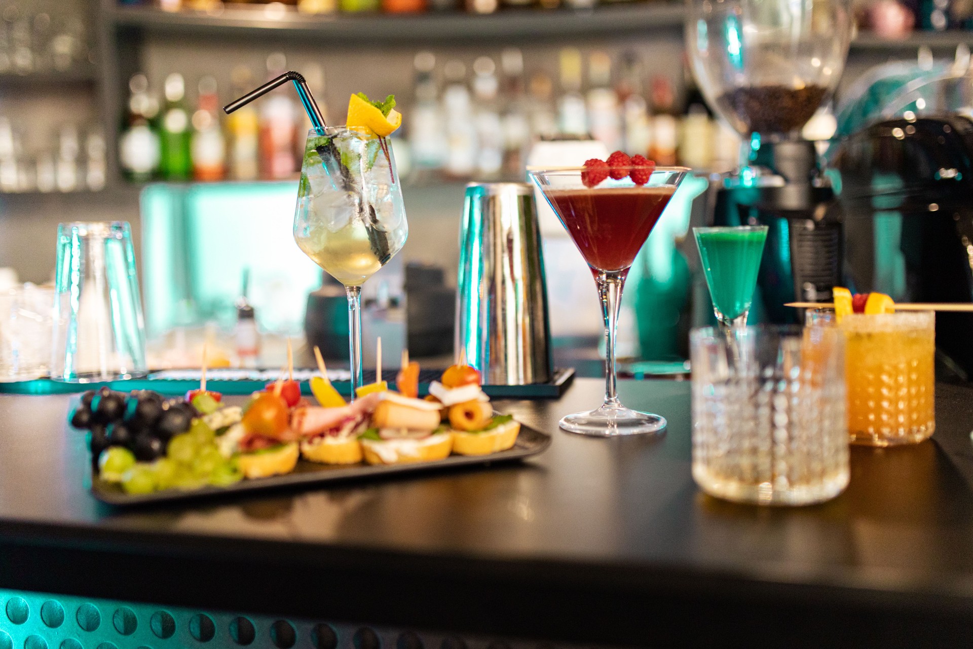 Cocktails and appetizers on bar counter